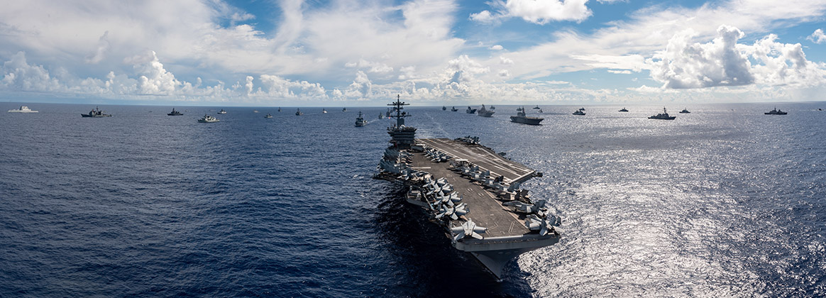 The Nimitz-class aircraft carrier USS Abraham Lincoln (CVN 72) sails in formation during Rim of the Pacific (RIMPAC) 2022.  